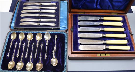 A cased set of six pairs of Edwardian ivory handled silver fish eaters and two other cased sets, one incomplete.